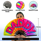 Large Festival Fans with vibrant colors and text, perfect for rave outfits and drag queen performances.