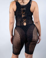 Back view of the Disco Doll Rhinestone Fishnet Romper, featuring a sleek fishnet style with shimmering rhinestones.