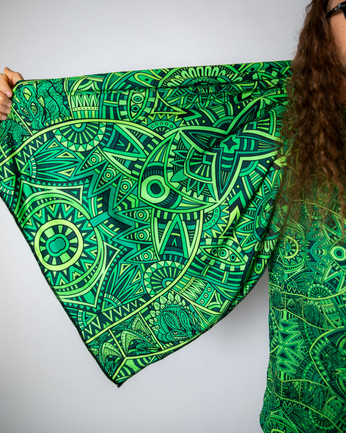 Vibrant green Dominion Festival Scarf with intricate psychedelic patterns and tiny dinosaur details.