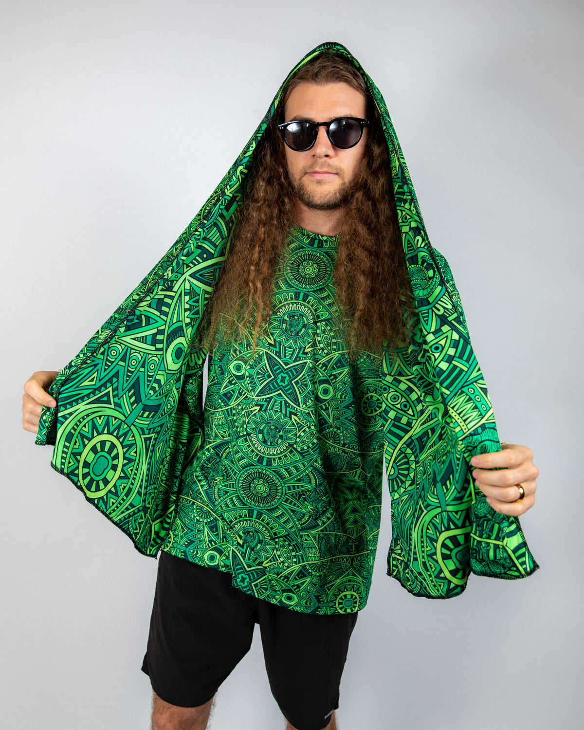 Model wearing the Dominion Festival Scarf with psychedelic green print, showcasing a bold and stylish oversized fit.