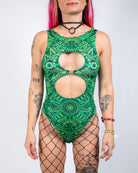 Dominion Keyhole Bodysuit in green with bold cutouts, perfect for rave or dance floor events.