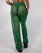 Dominion Mesh Lucy Pants in neon green tribal print, showcasing a stylish wide leg design perfect for rave bottoms.