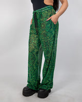 Dominion Mesh Lucy Pants featuring vibrant tribal print, pockets, and wide leg design perfect for rave bottoms.