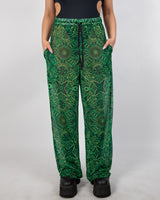 Dominion Mesh Lucy Pants in neon green tribal print, featuring pockets and a wide leg for rave style.