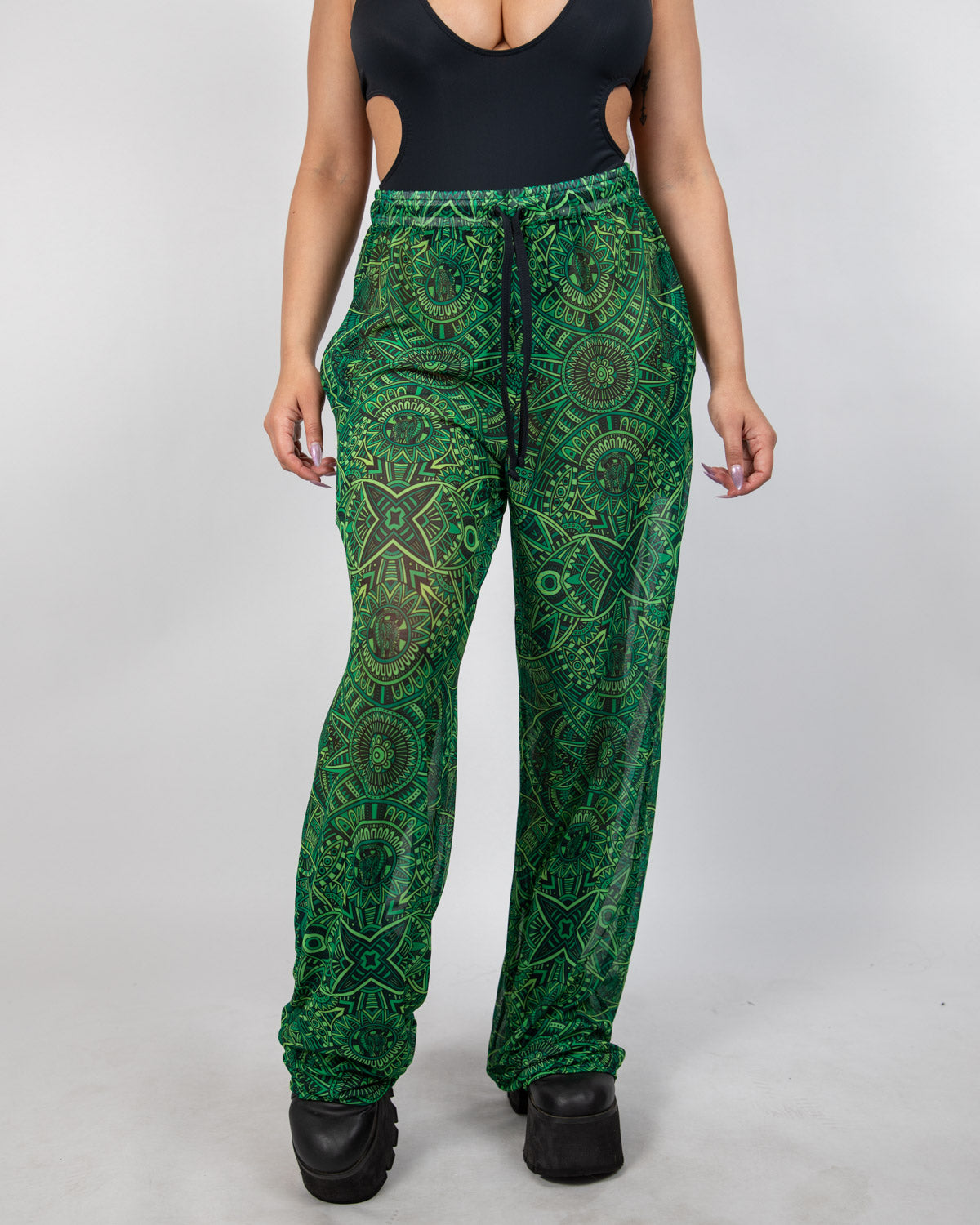 Dominion Mesh Lucy Pants featuring a neon green tribal print, perfect for rave bottoms and comfortable movement.