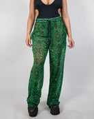 Dominion Mesh Lucy Pants featuring a neon green tribal print, perfect for rave bottoms and comfortable movement.