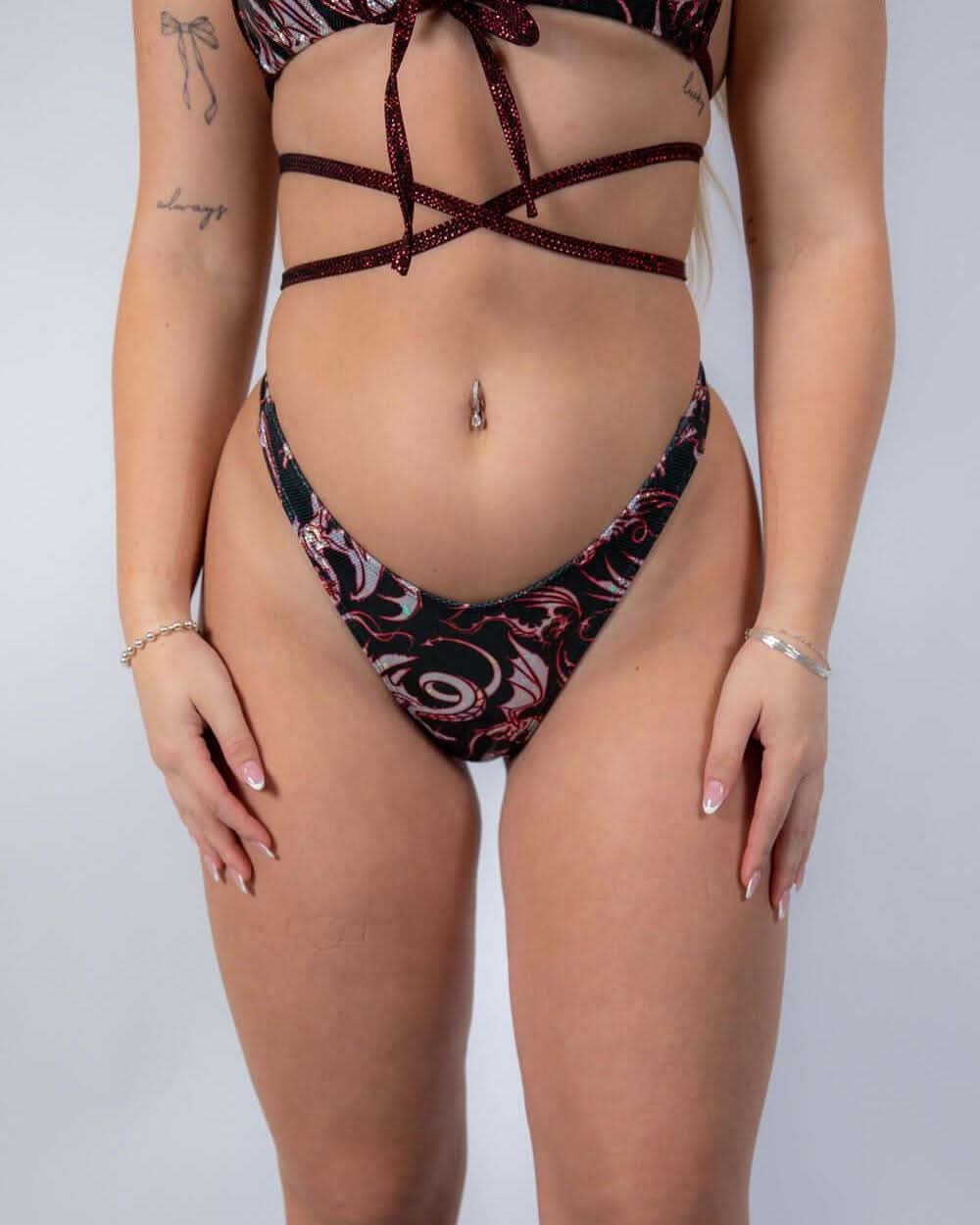 Front view of the Drakonis Risk Bottoms highlighting the daring cut and waistband detail.