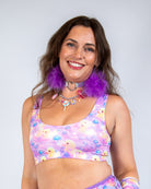 Model wearing the Duckies Classic Top, a vibrant cropped rave outfit featuring purple, yellow, and pink colors.