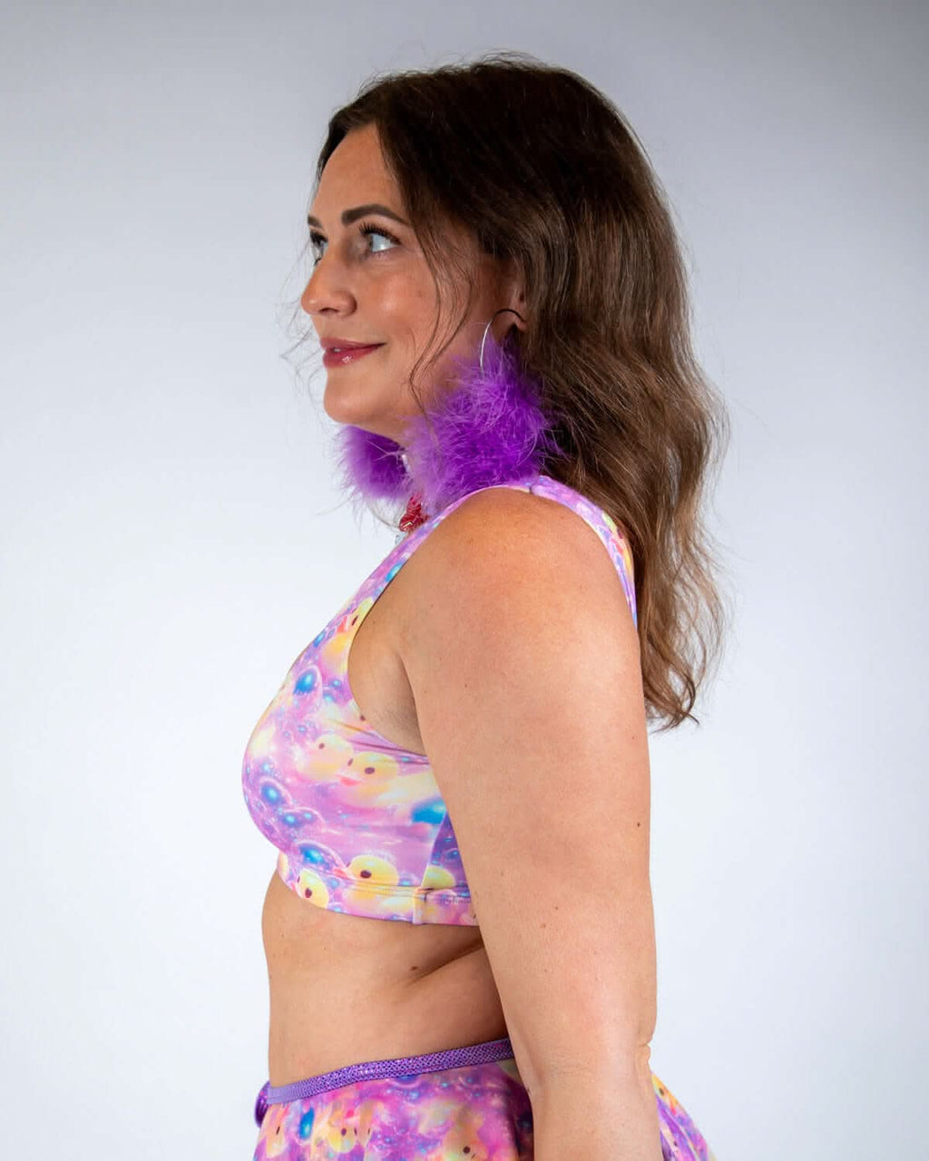 Model wearing Duckies Classic Top in vibrant purple, yellow, and pink colors, showcasing rave outfits style and comfort.