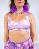 Model wearing Duckies Classic Top with vibrant purple and pink print, perfect for rave outfits.