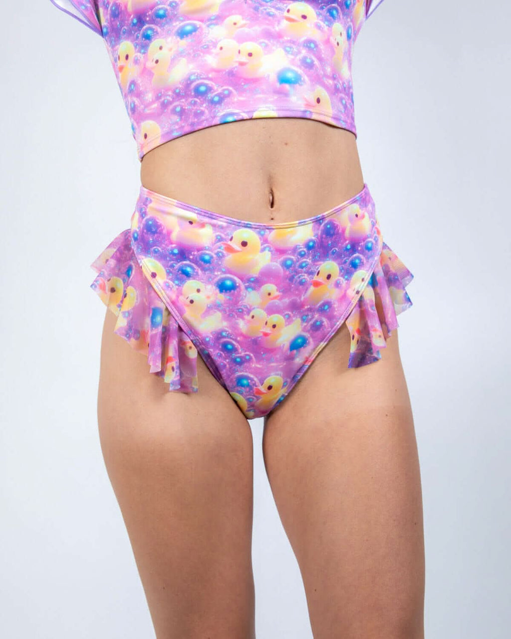 Duckies High Waisted Thong with Ruffles in vibrant purple, yellow, and pink print, perfect for rave outfits.