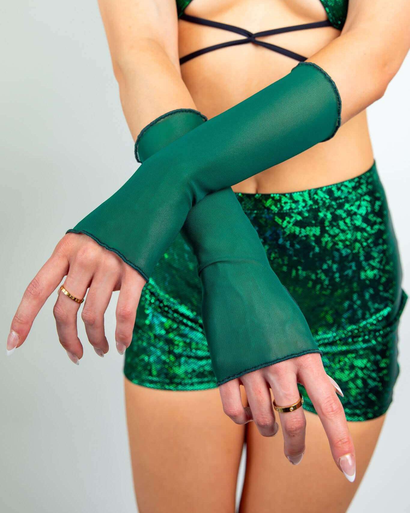 Emerald mesh gloves displayed on a model, perfect for rave outfits and enhancing festival looks.