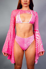 A woman wearing a pink and white bikini with matching mesh bell sleeves.