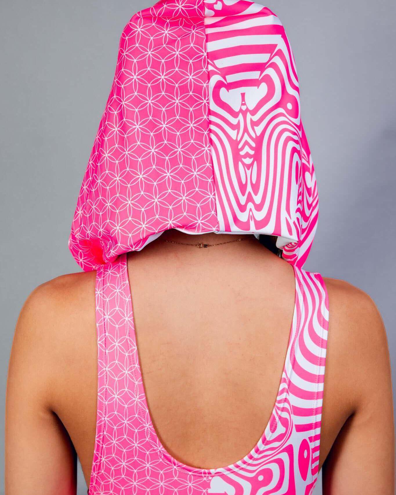 Reversible neon pink Electricity Assassin Hood showcasing vibrant patterns, perfect for rave outfits and festivals.