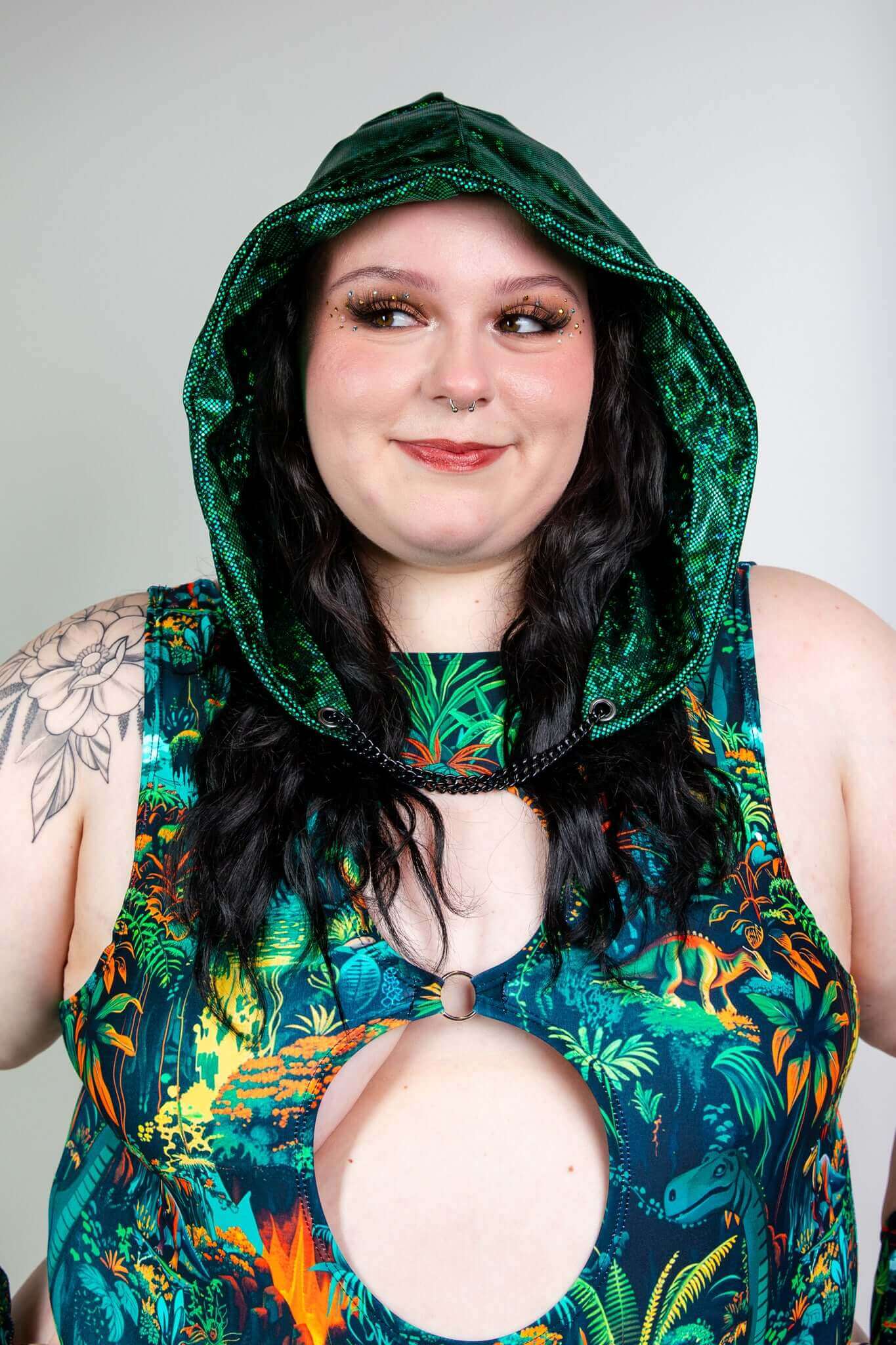 Freedom Rave Wear plus-size rave bodysuit with a shimmering green hood and neon jungle print, perfect for standing out at rave events.