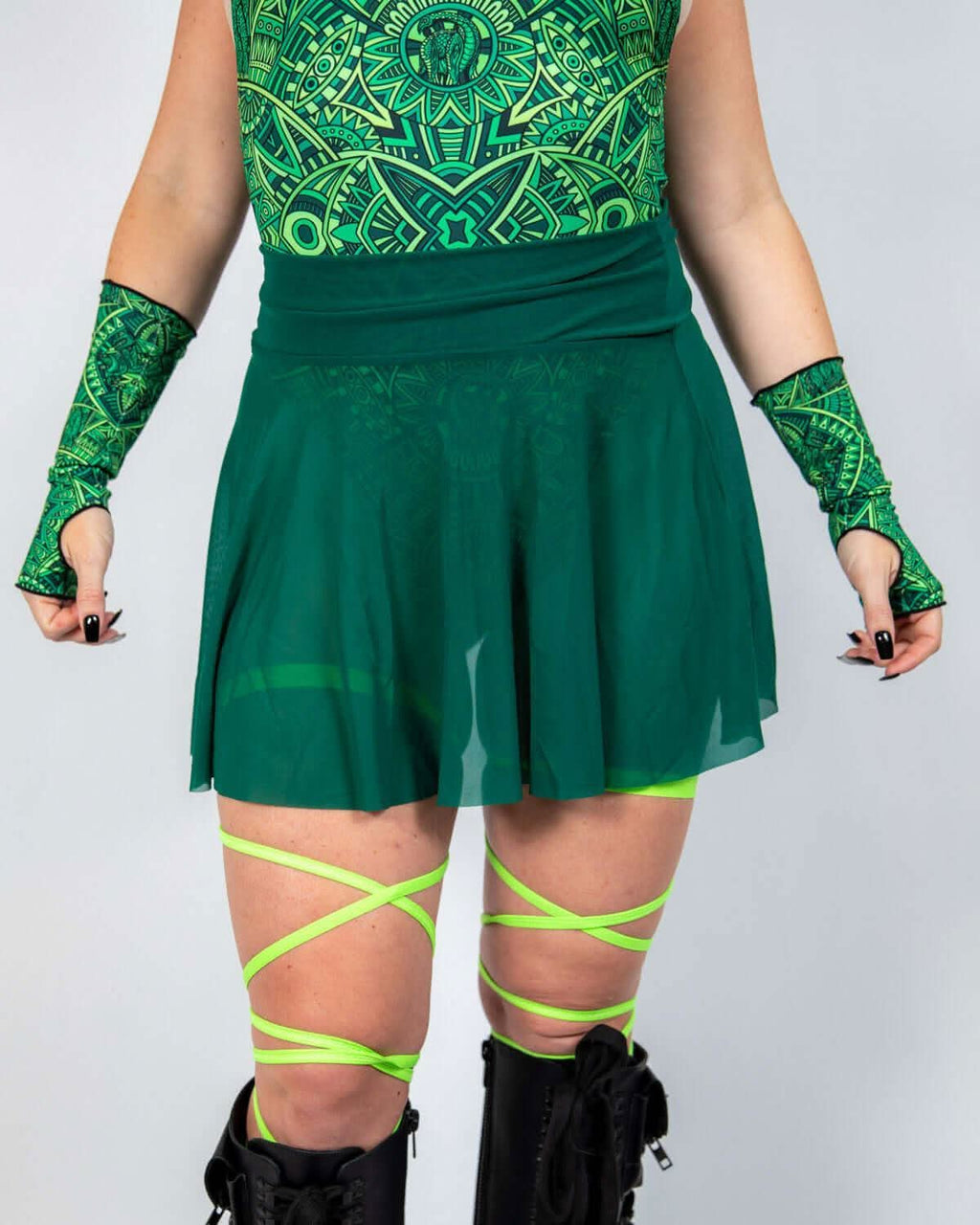 Emerald Mesh Skater Skirt paired with green accessories, perfect for rave outfits and festival vibes.