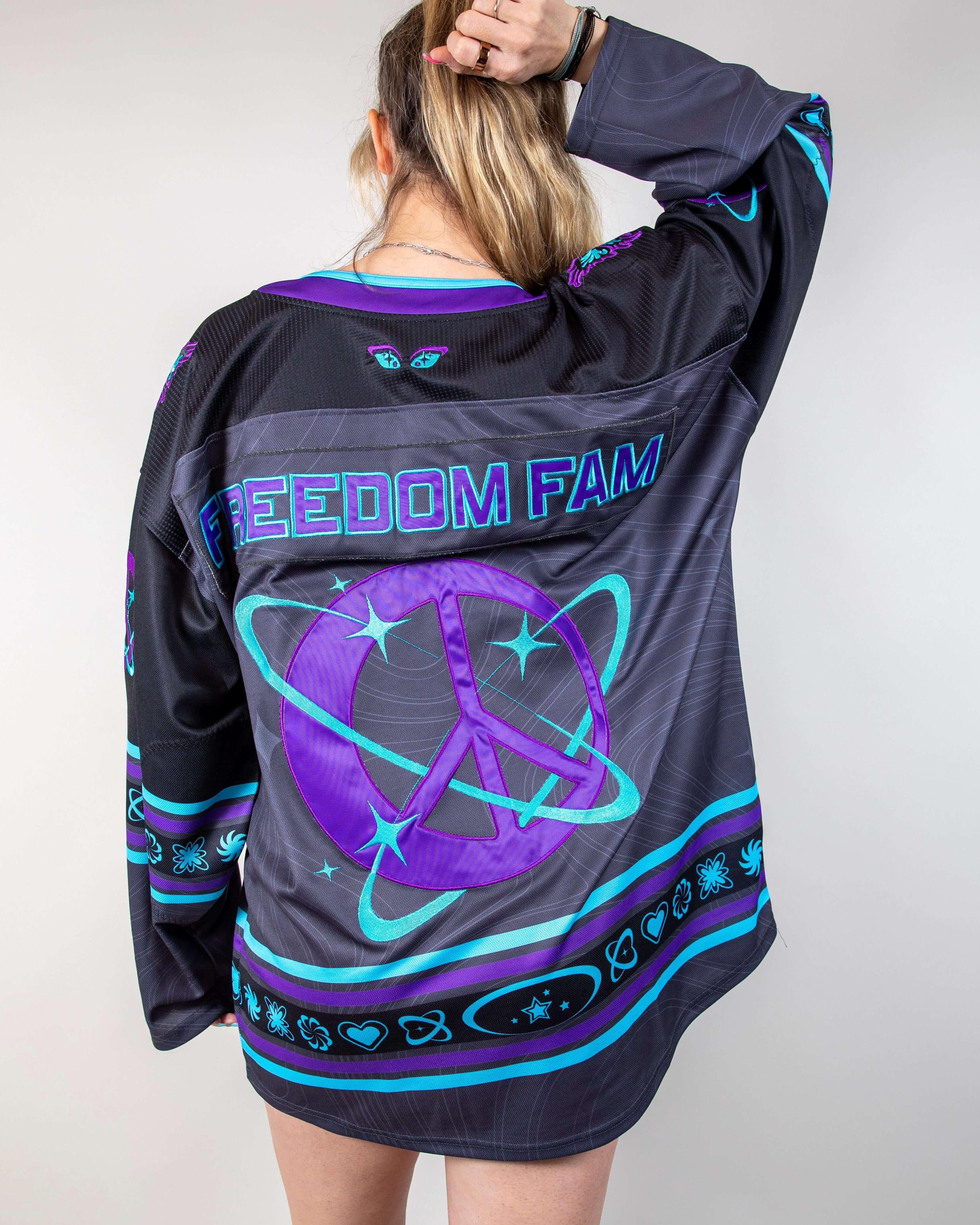 Freedom Fam limited edition hockey jersey featuring vibrant purples and blues, perfect for rave outfits.