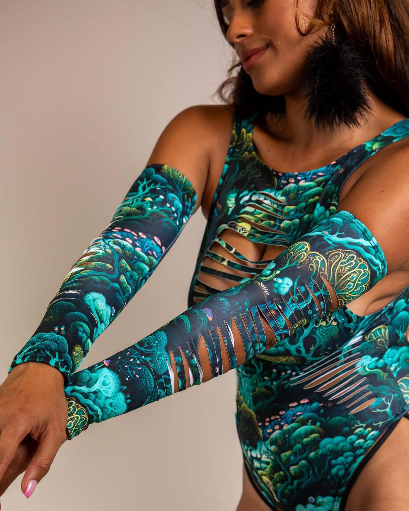 Model showcasing Faewood Slit Arm Sleeves with vibrant forest design, perfect for rave outfits and adding magic to any look.