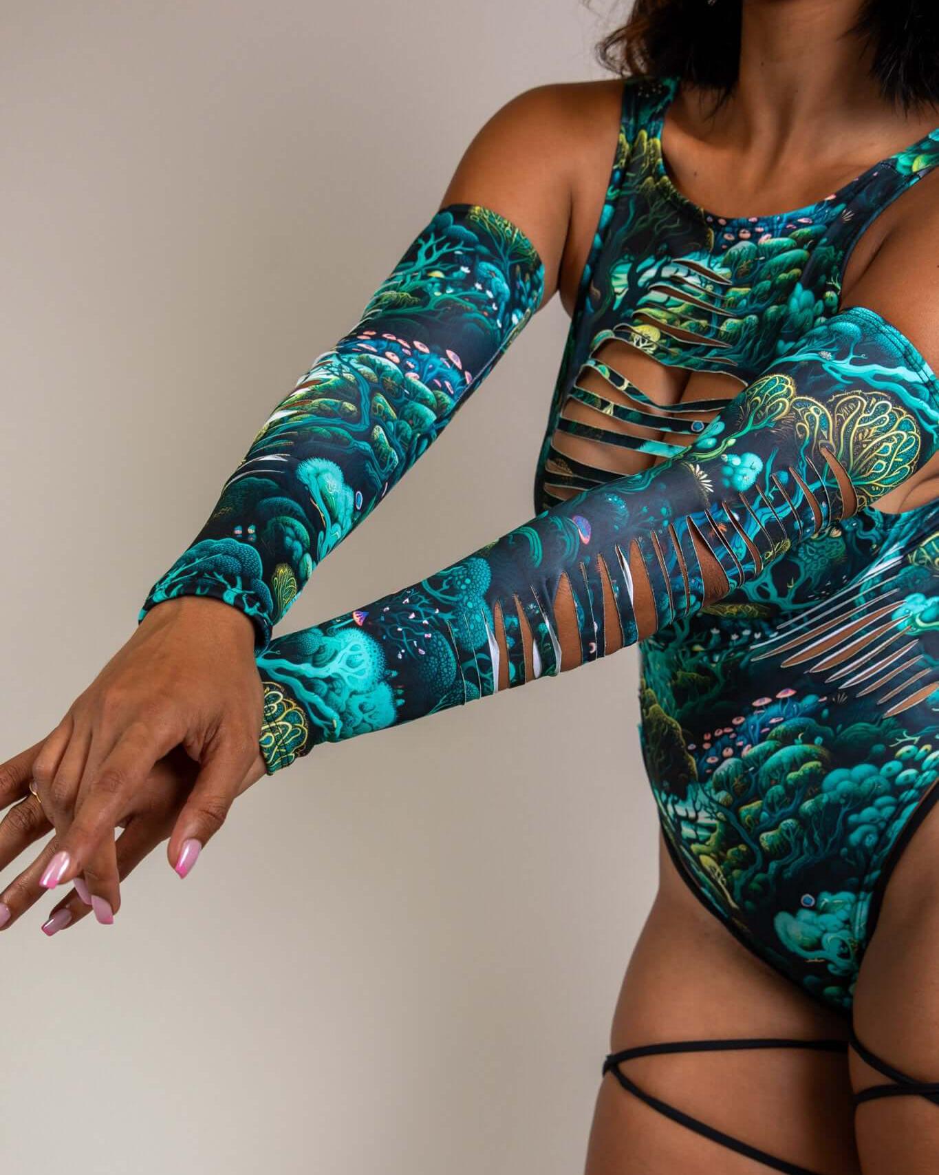 Model showcasing Faewood Slit Arm Sleeves with vibrant forest print, perfect for rave outfits and adding a magical touch.