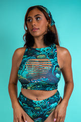 Front view of Faewood Slit Crop Top with forest-inspired print and unique slit detail, ideal for rave, festival, and street style outfits.