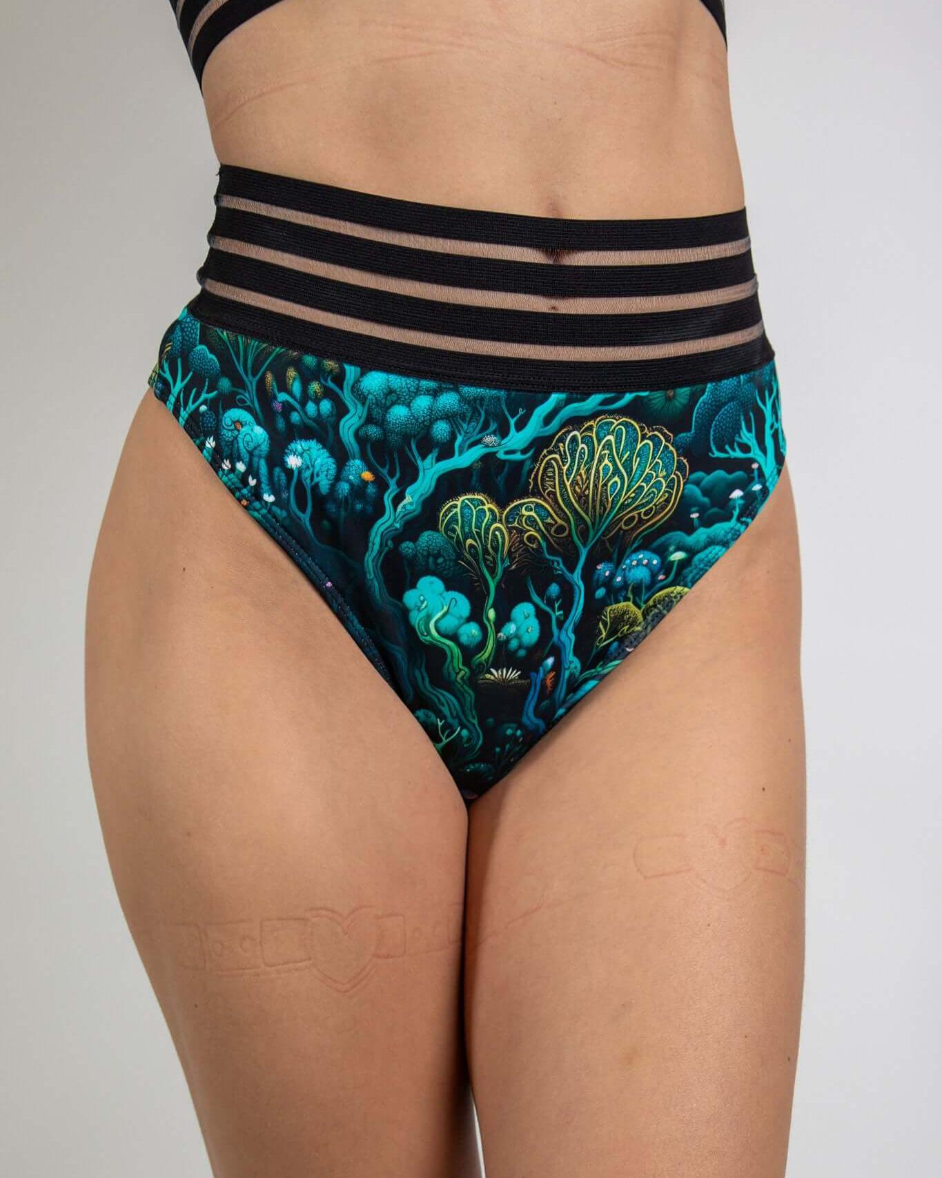 Faewood Sporty Bottoms featuring a high-waisted Brazilian cut with vibrant forest-inspired prints, ideal for rave outfits.