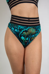 Faewood Sporty Bottoms featuring a high-waisted Brazilian cut with vibrant forest-inspired prints, ideal for rave outfits.