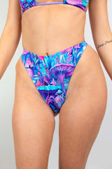 Fairycore Retro Thong Bottoms featuring a vibrant mushroom print in blue, pink, and purple, perfect for rave outfits.