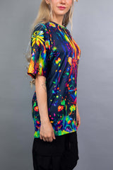 Model wearing a Freedom Rave Wear oversized tee with a vibrant, fantasy forest design. A colorful and enchanting look for any festival.