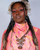 Model showcasing vibrant Fire Bandana with neon swirl print, perfect for rave outfits, highlighting summer festival looks.