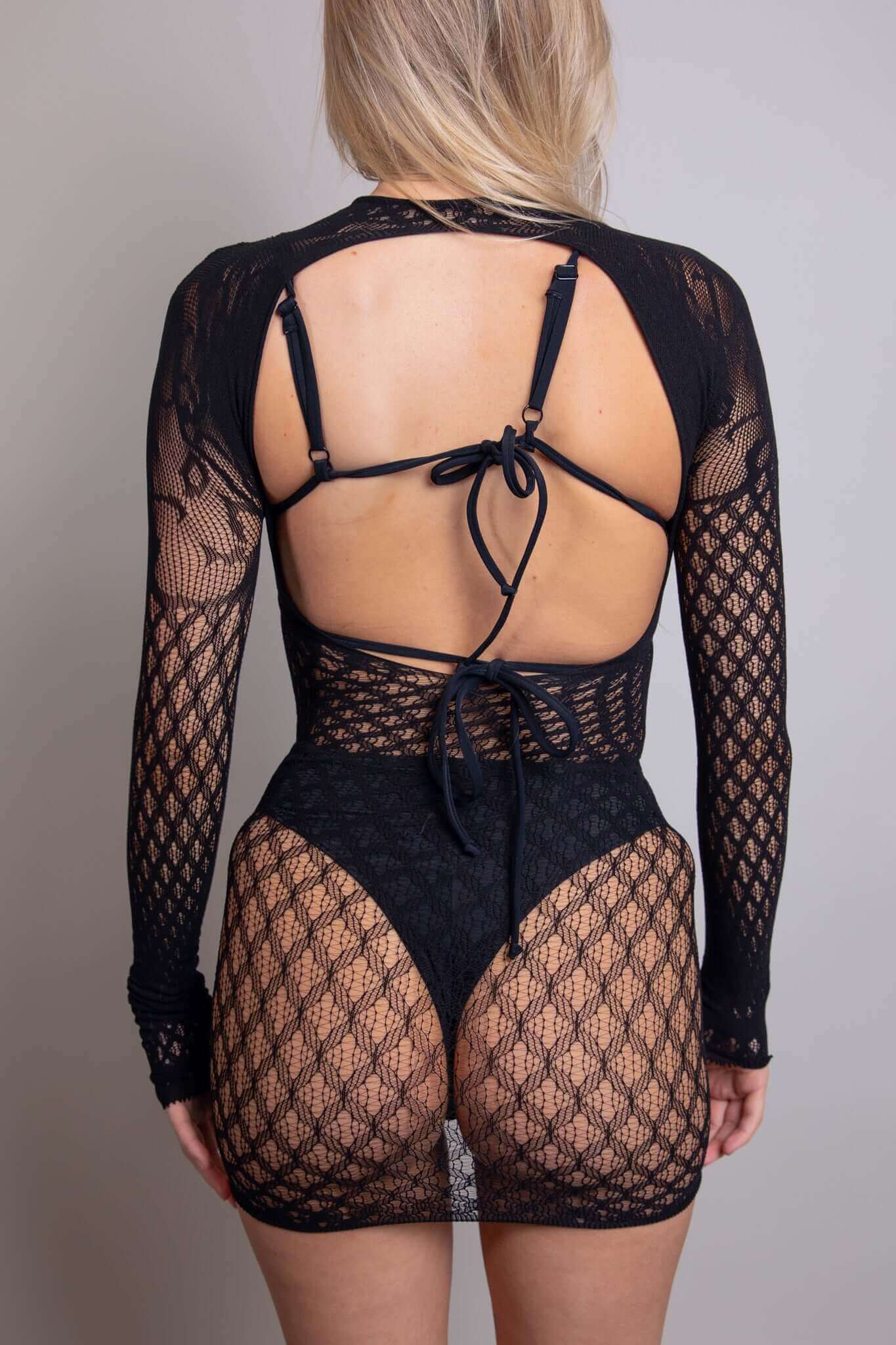 Back view of a black Victorian long sleeve fishnet dress, featuring a halter neck and stylish cutouts, perfect for rave outfits.