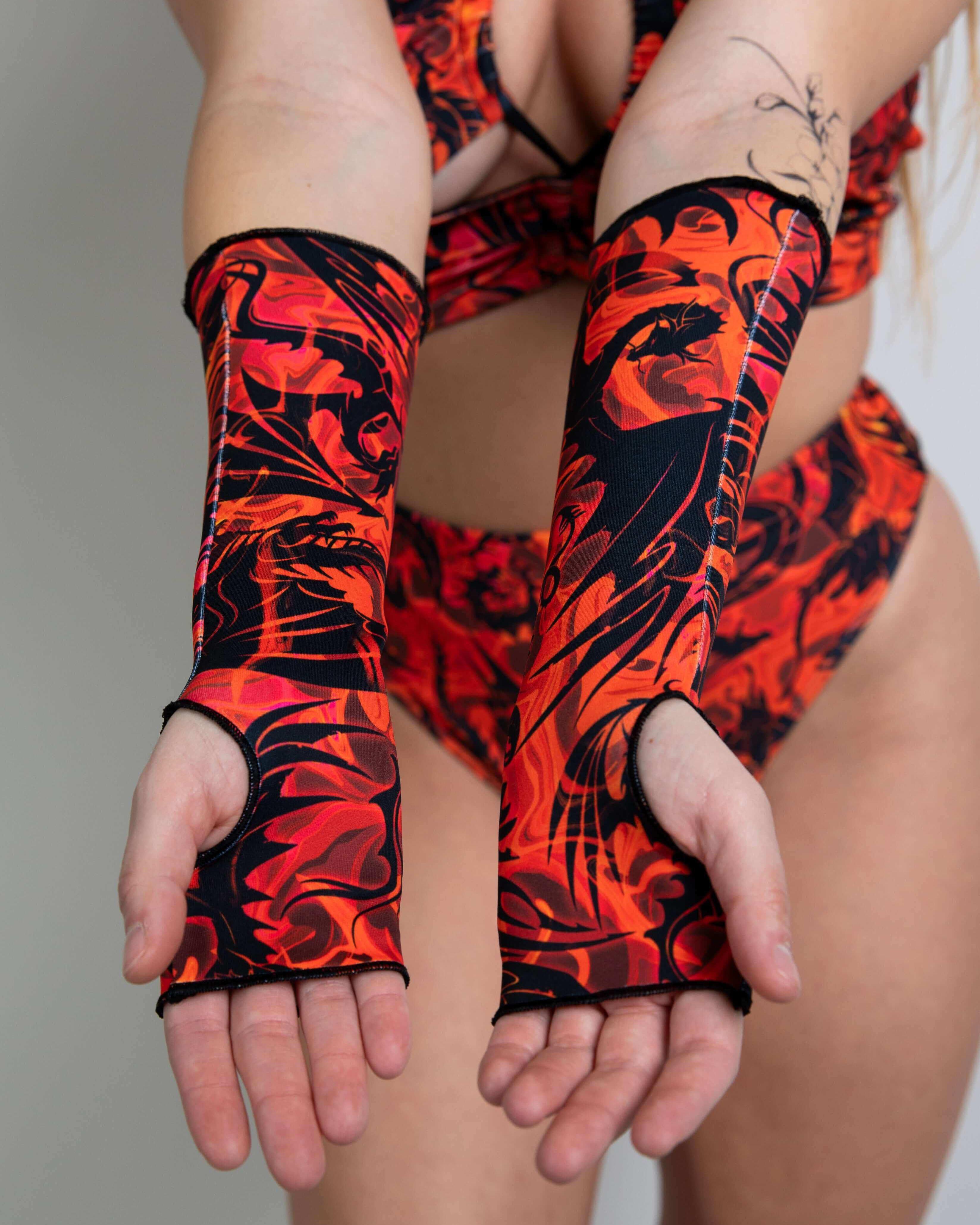 Model showcasing Forbidden Gloves with vibrant red and black design, perfect for rave outfits and stylish events.