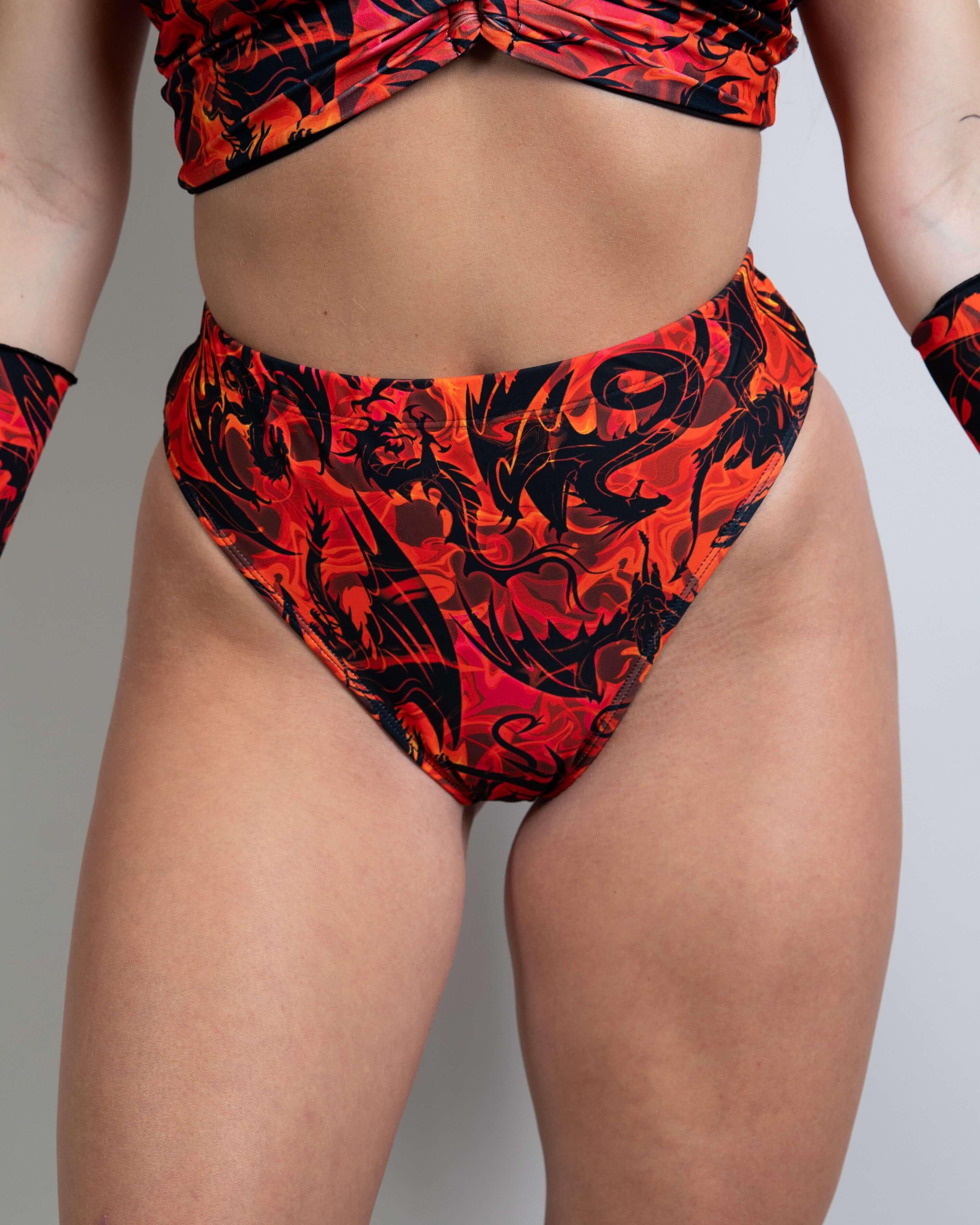 High waisted Brazilian bottom in fiery red and black print, perfect for rave outfits and festivals.