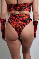 Back view of Forbidden High Waisted Brazilian Bottoms, featuring a red and black magma print with a cheeky Brazilian cut and high-rise fit.