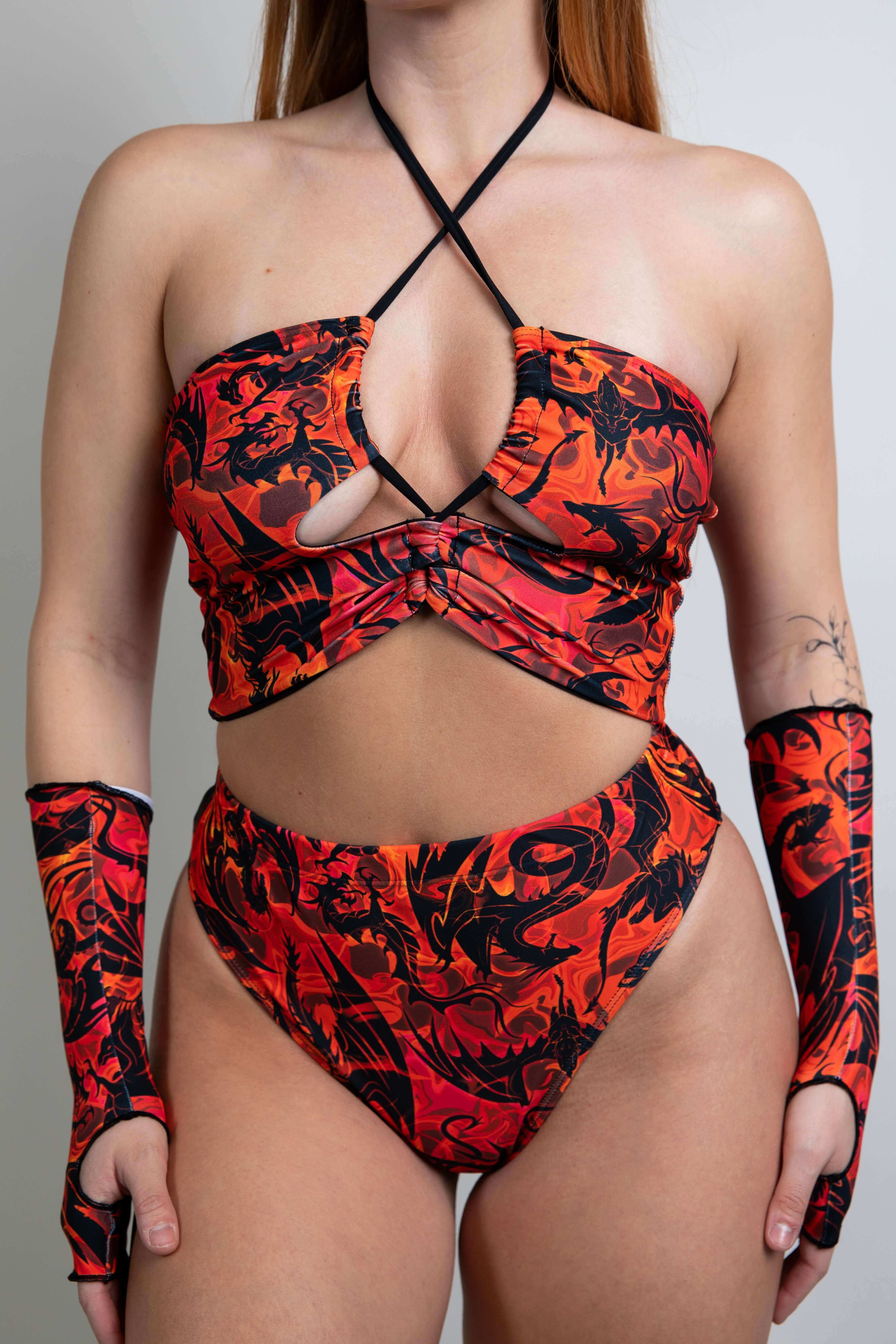 Model wearing the Ibiza Top with fiery red and orange dragon print.