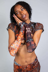 Model showcasing Fossil Arm Sleeves, perfect for rave outfits, demonstrating cozy and stylish fit.