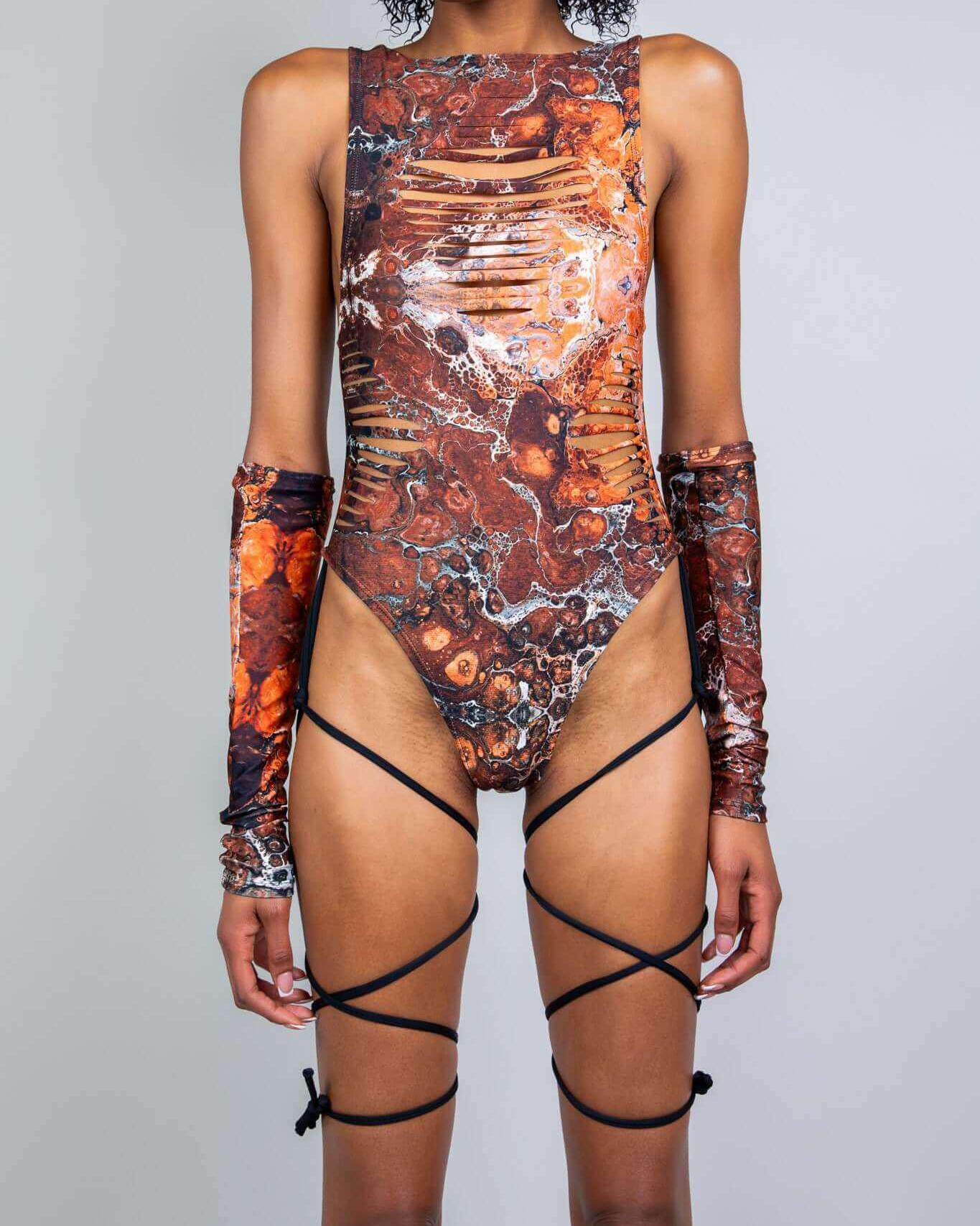 Model wearing a Fossil Slit Sideboob Bodysuit with natural fossil pattern and slits, perfect for rave outfits.