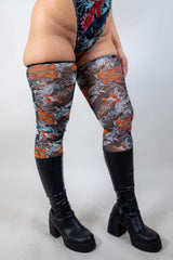 Close-up of Good Fortune Mesh Leg Sleeves, highlighting the sheer mesh fabric and vibrant tattoo-inspired design.