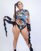 Good Fortune Wavy Baby Bodysuit Set worn by model in colorful tattoo-inspired design.