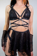 Black Heartthrob Harness featuring chains and bows, perfect for rave outfits and bold fashion statements.