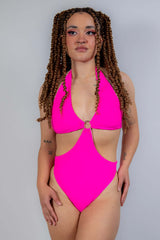 Full-body front view of the Hot Pink O-Ring Bodysuit, emphasizing its bold cut and eye-catching festival look.