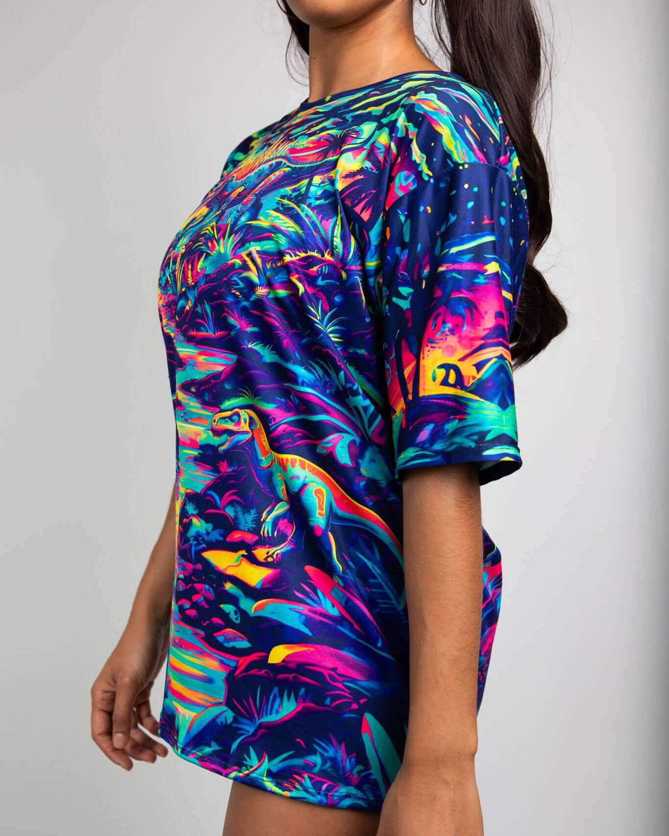 Model wearing Hunter Oversized Softee tee with vibrant dinosaur design, perfect for rave outfits and festivals.