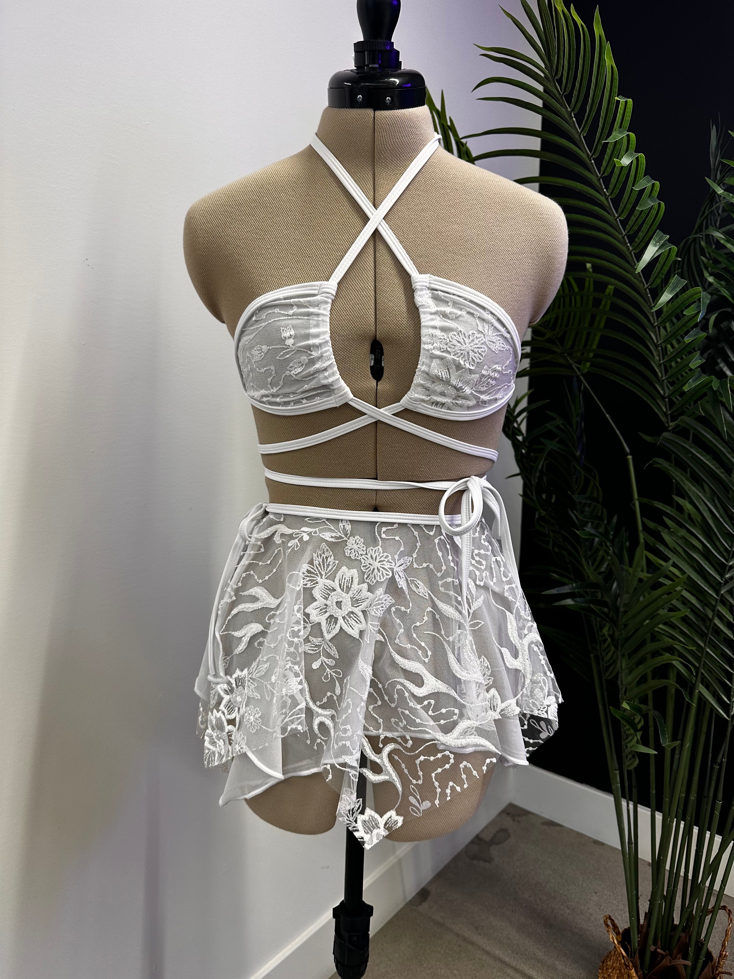 Seraphina Fairy Skirt in white, front view, featuring lace layers and asymmetrical hem, perfect for rave fashion and festival wear.