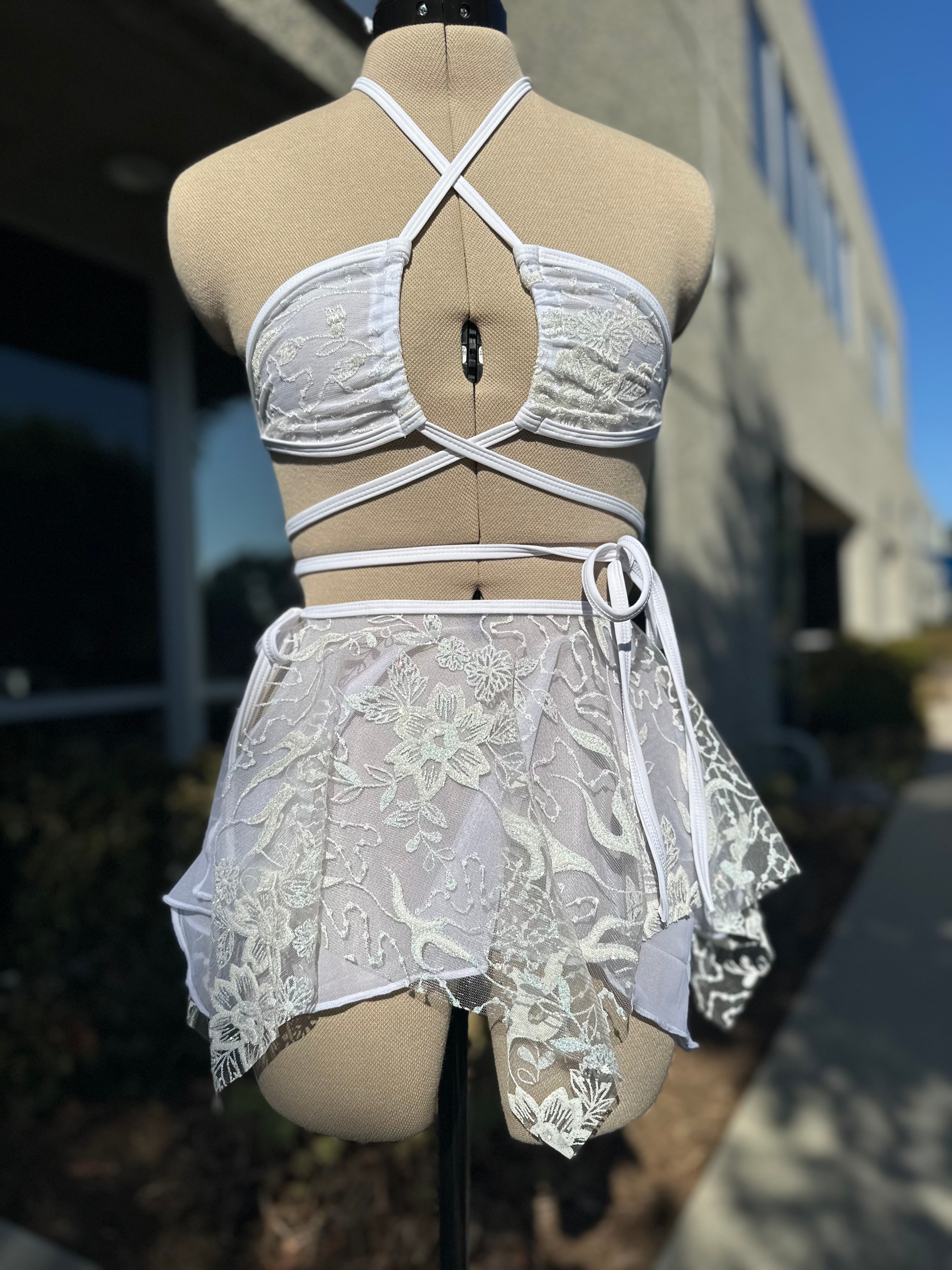 Seraphina Wrap Bikini Top in white, front view with halter neckline and wrap-around straps, ideal for rave and festival fashion.