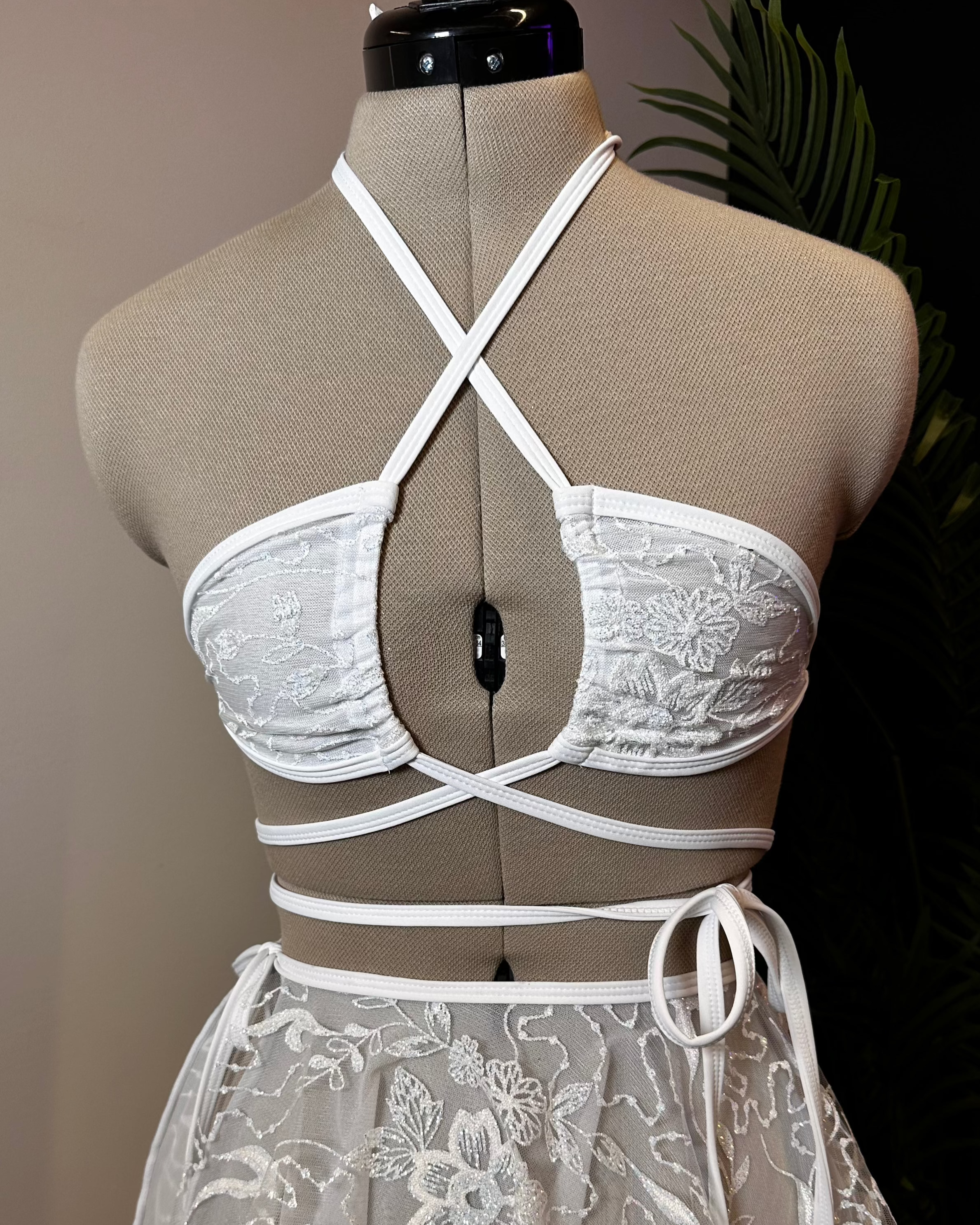 Seraphina Wrap Bikini Top in white, front view with wrap-around straps and halter neckline, displayed on mannequin.