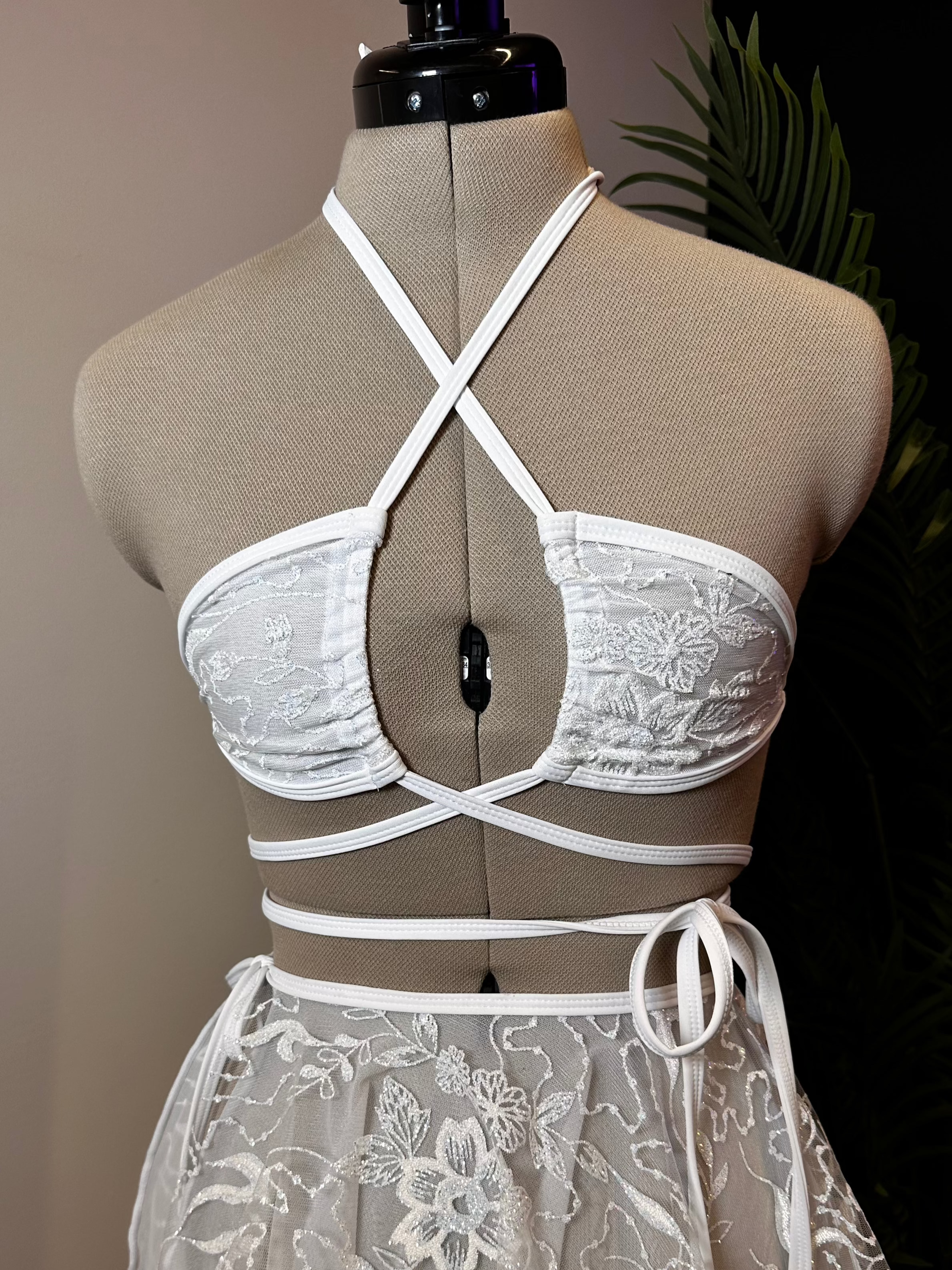 Seraphina Wrap Bikini Top in white, front view with wrap-around straps and halter neckline, displayed on mannequin.