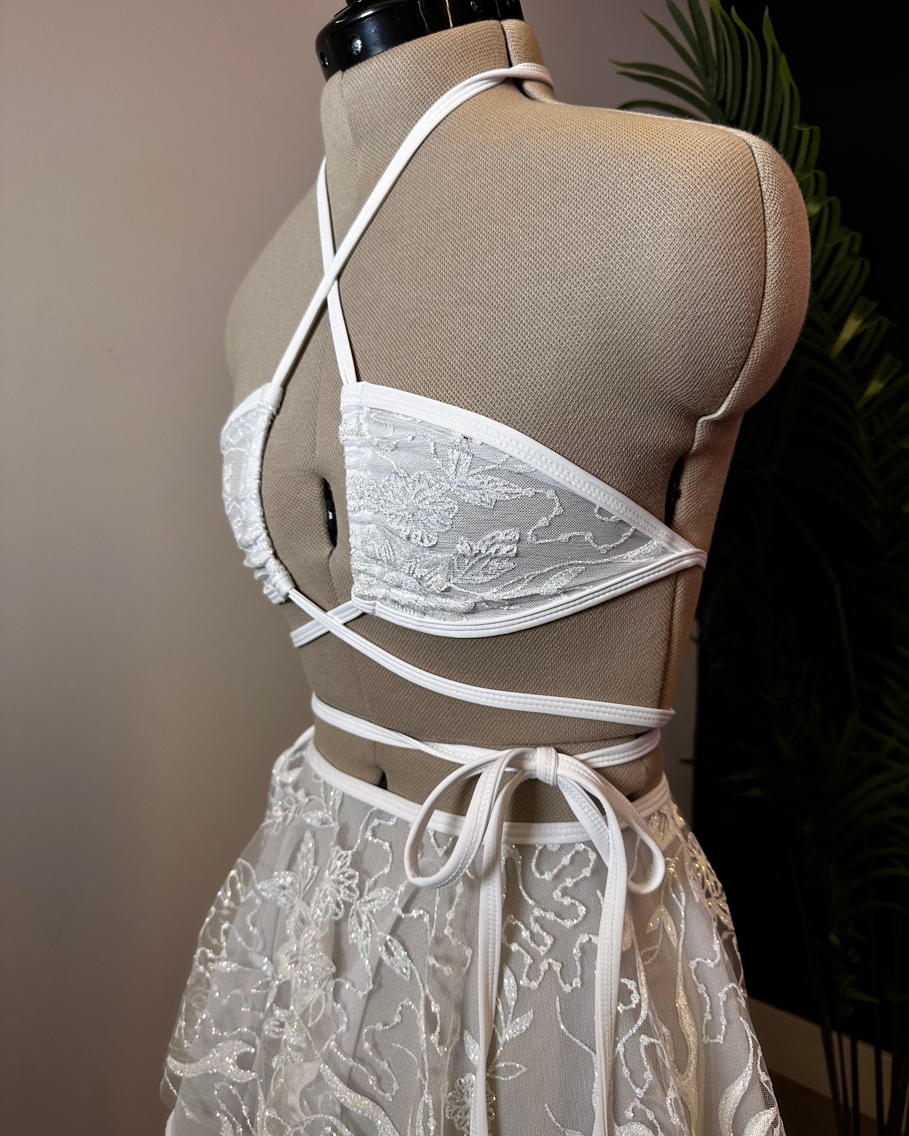 Seraphina Wrap Bikini Top in white, side view showing crisscross straps and wrap-around tie, perfect for rave and festival fashion.