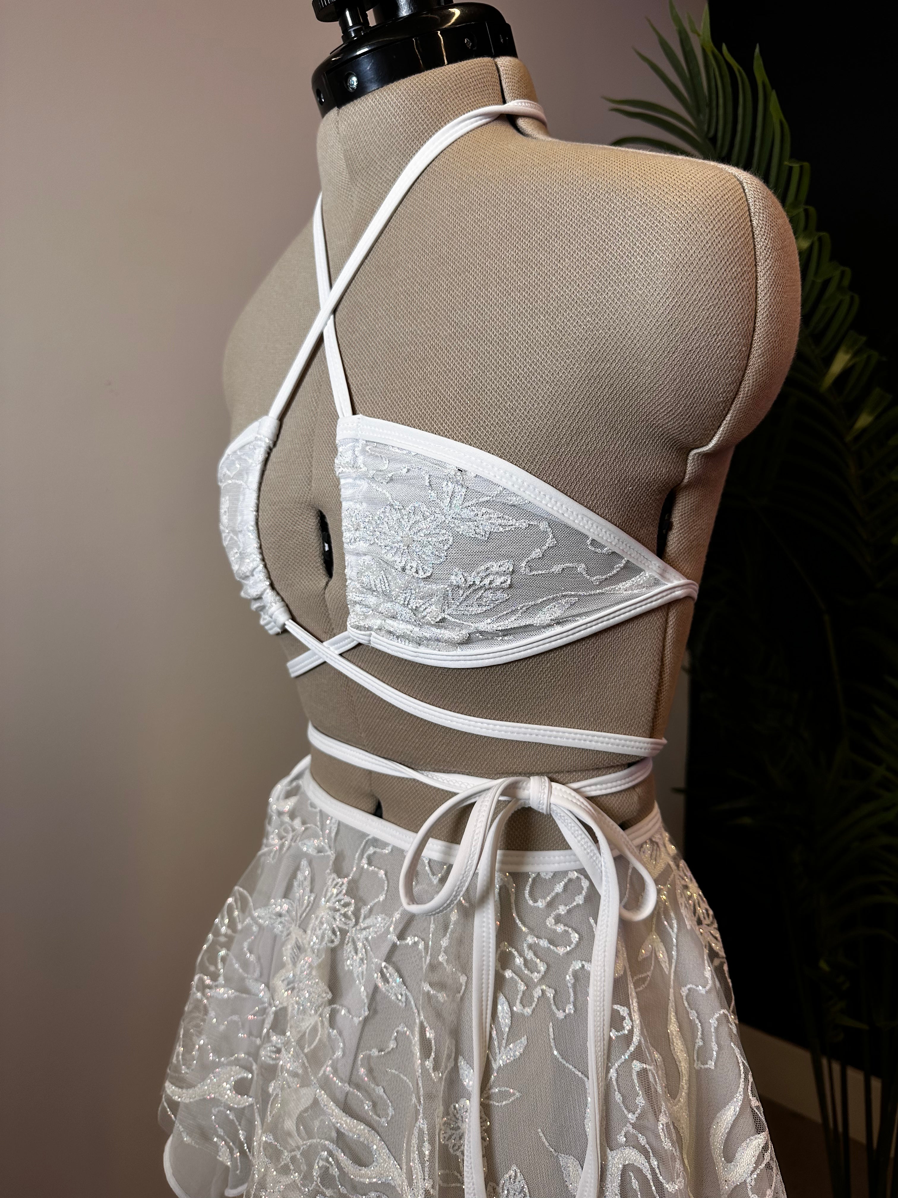 Seraphina Wrap Bikini Top in white, side view showing crisscross straps and wrap-around tie, perfect for rave and festival fashion.