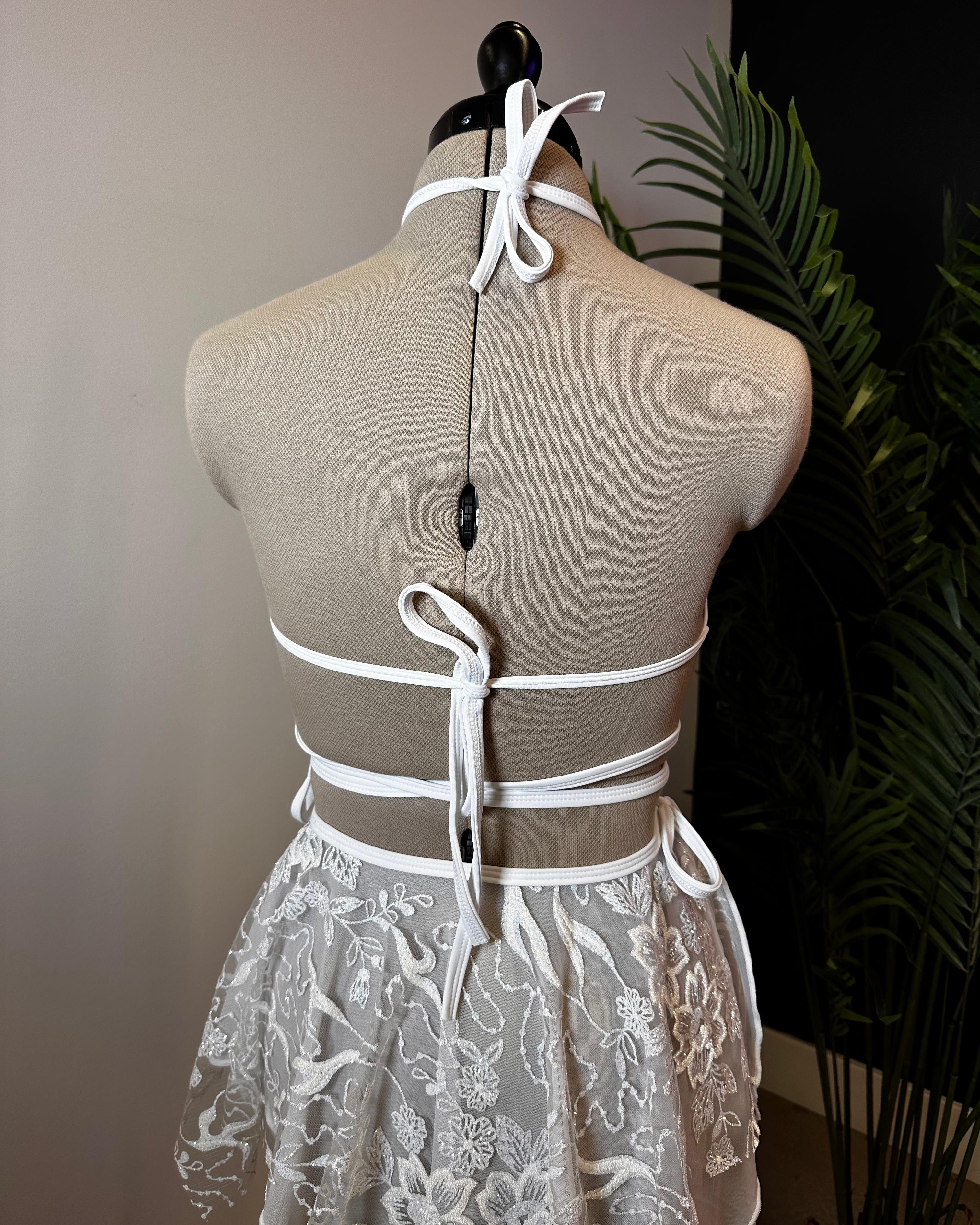 Seraphina Wrap Bikini Top in white, back view with adjustable halter strap and wrap-around detailing, for perfect fit and look.