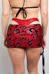 Freedom Rave Wear red mini skirt features bold black patterns, adding vibrant style to rave outfits. Perfect for making a statement at any festival.