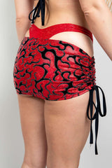 Freedom Rave Wear red mini skirt features bold black patterns, adding vibrant style to rave outfits. Perfect for standing out at any festival.